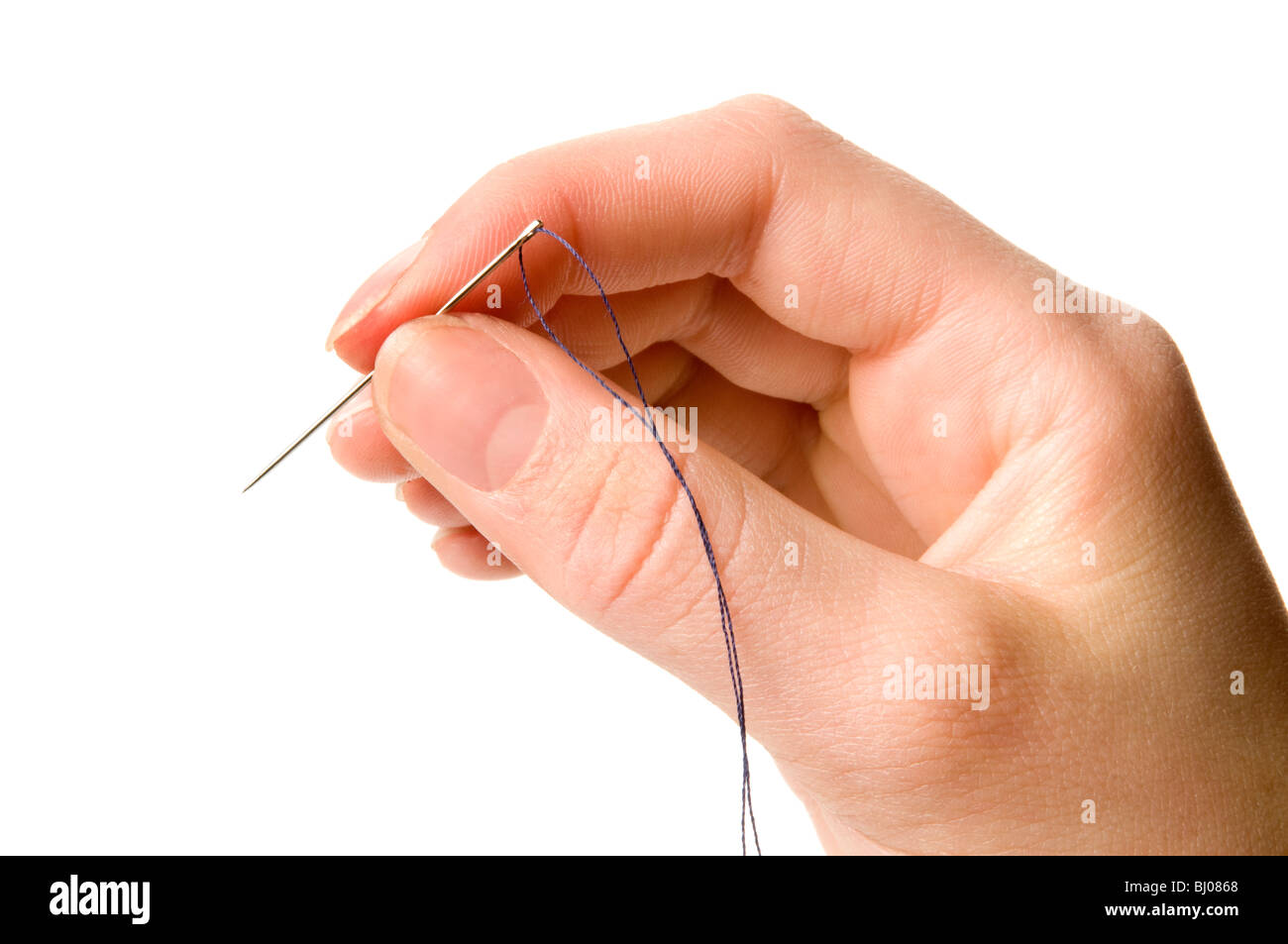 hand holding needle and thread Stock Photo - Alamy