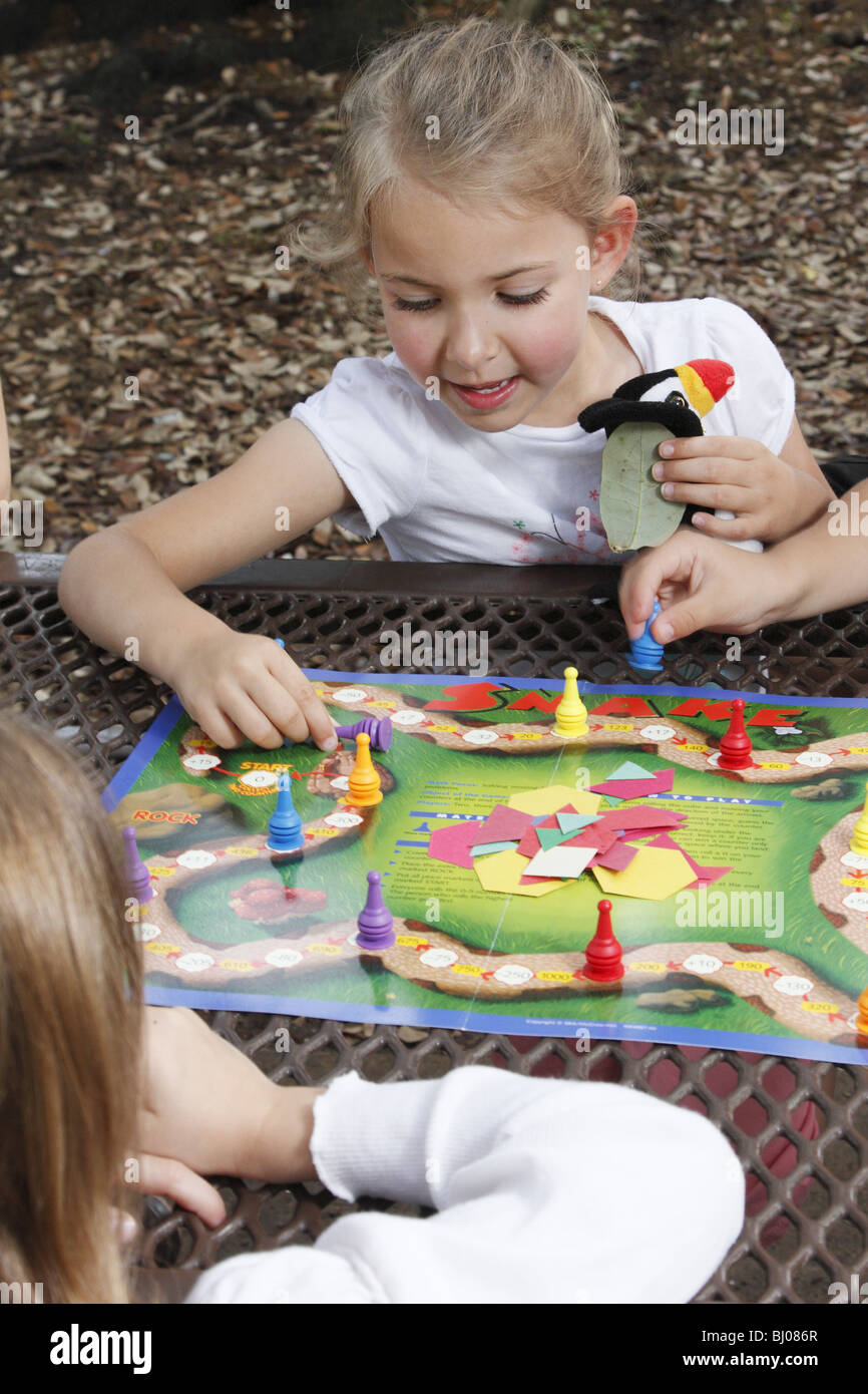Kids playing a board game Stock Photo Alamy