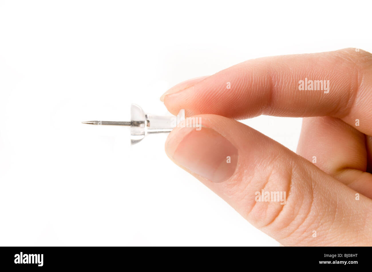 hand holding push pin Stock Photo Alamy