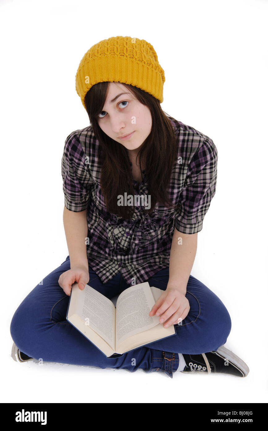 teenage girl reading a book isolated on white, cutout Stock Photo