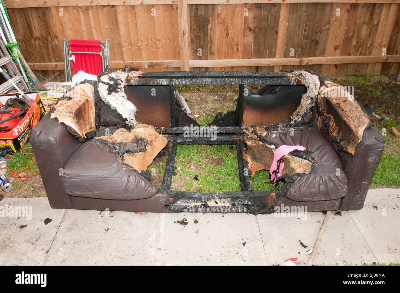 burnt sofa following cigarette fire Stock Photo Alamy
