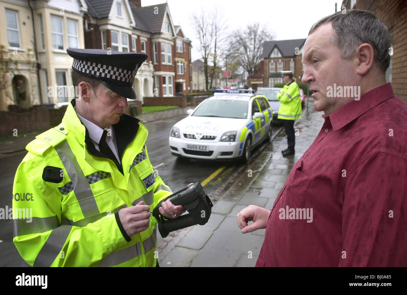 Police use an electronic machine that reads and analises finger prints UK Stock Photo
