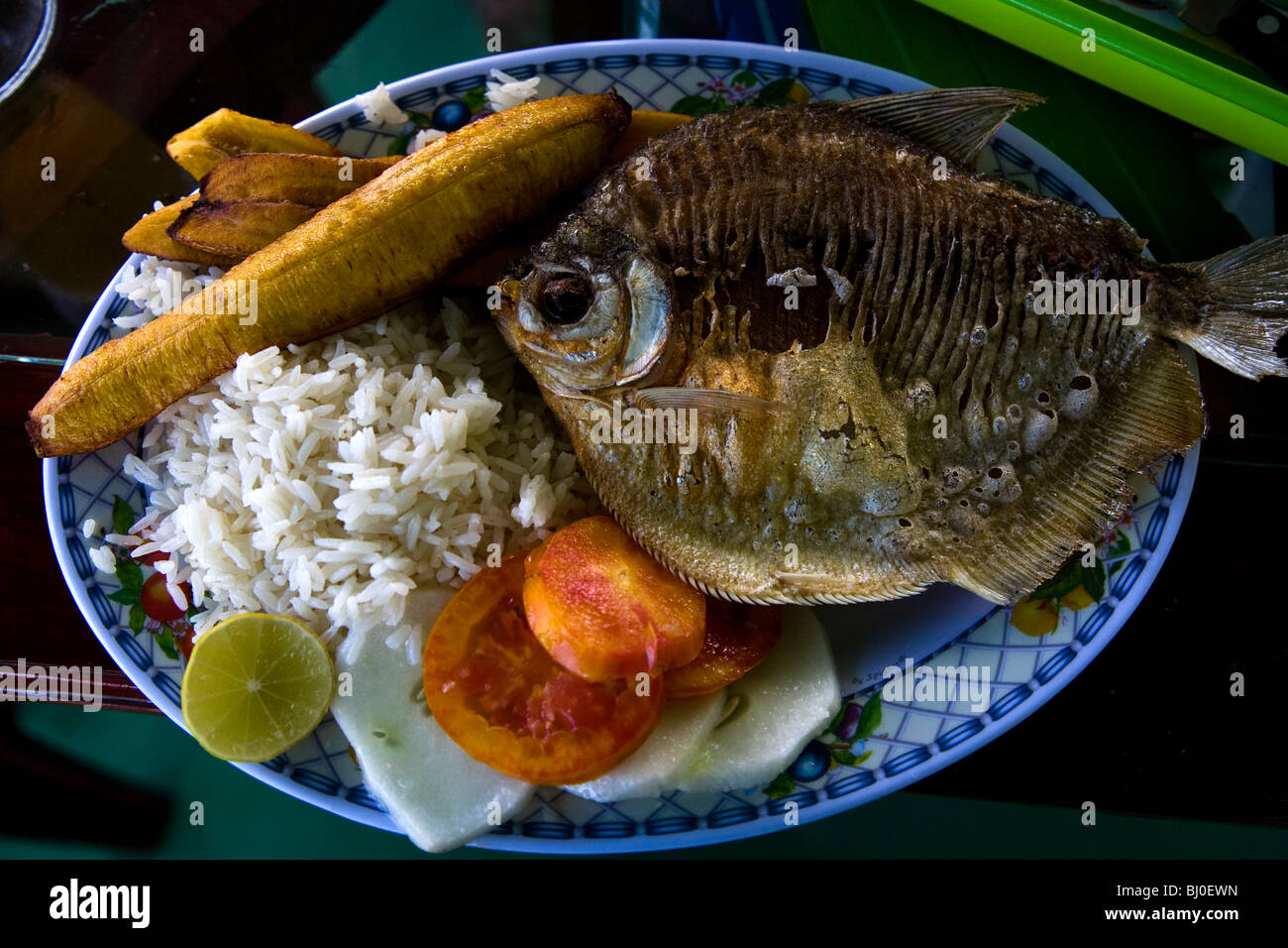 A typical Amazonian meal in Atalaya, Brazil near the border with Peru of fried fish, rice, and