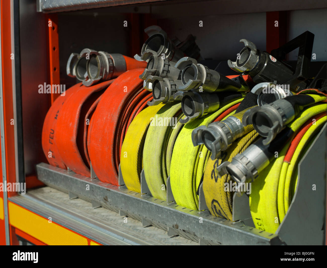 Fire extinguisher and fire hose reel in a parking building Stock