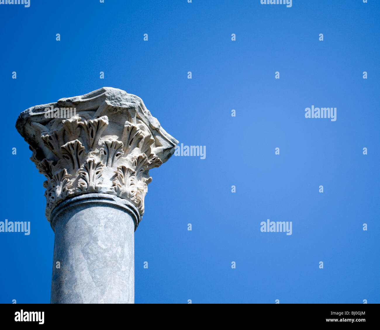 Corinthian column against a blue sky Stock Photo