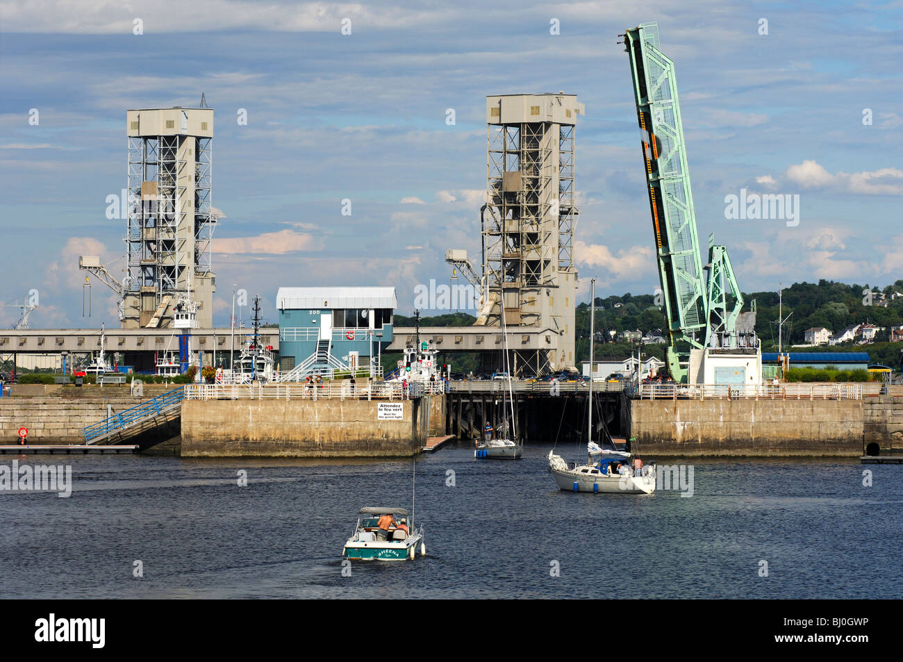 Boat lock and open drawbridge in the basin of the river port on the St. Lawrence River, Quebec City, Canada Stock Photo