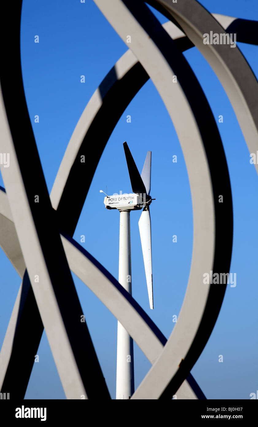 A wind turbine seen through the sculpture 'Spirit of the Staithes' at Blyth harbour, Northumberland, England. Stock Photo