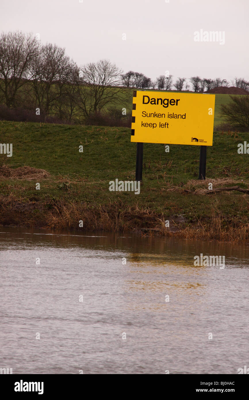 Sign on the river trent saying danger sunken island keep left Stock Photo