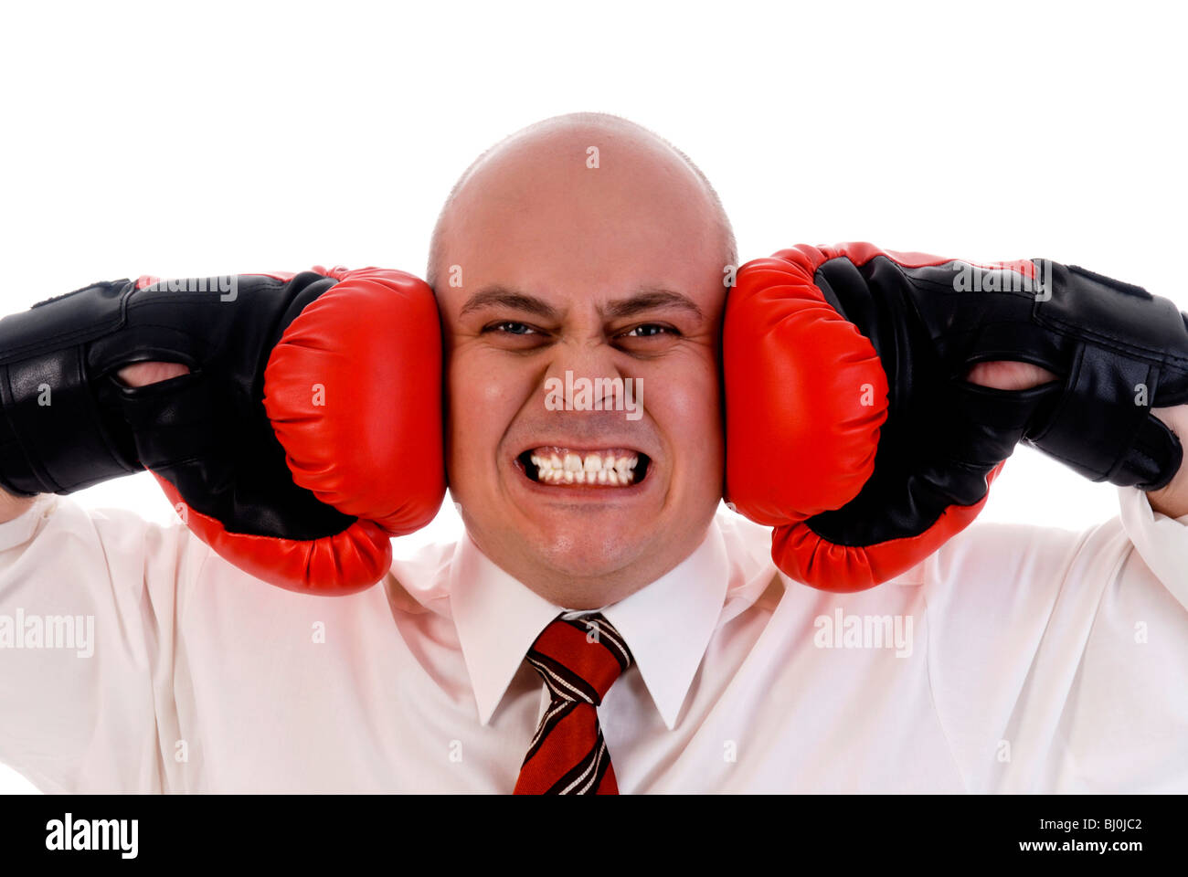 Businessman with boxing gloves Stock Photo