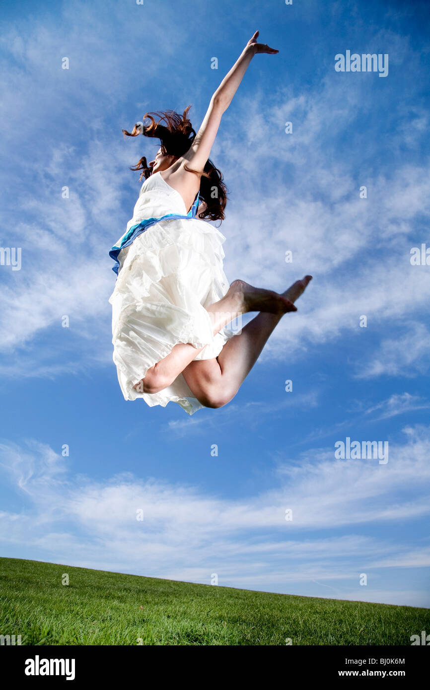Barefoot jumping woman grass hi-res stock photography and images - Alamy