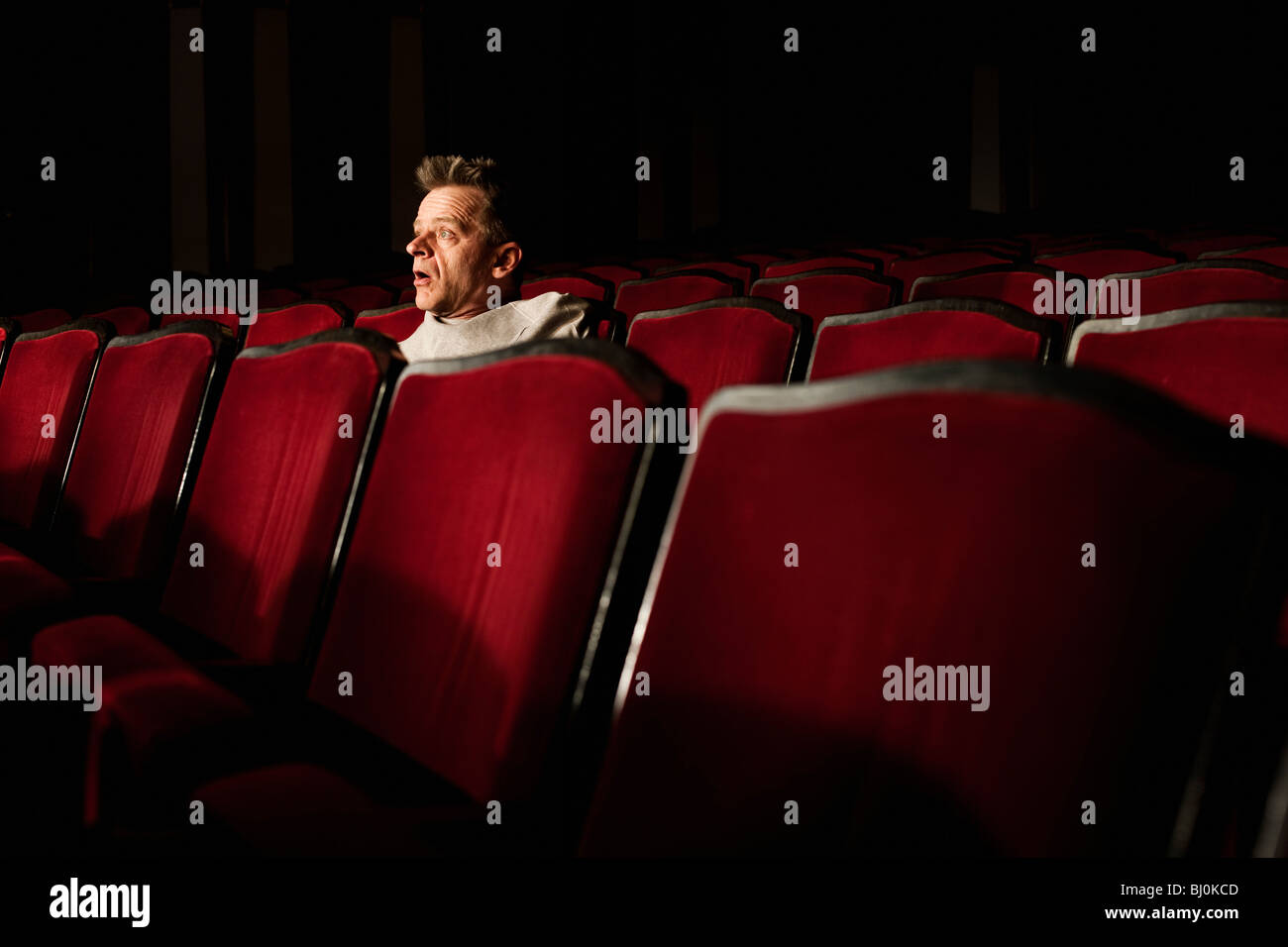 portrait of spectator watching theatre play Stock Photo, Royalty Free ...