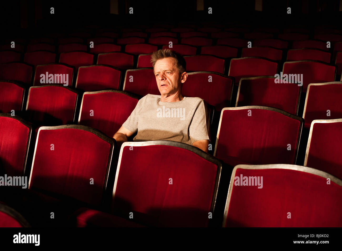 portrait of spectator watching theatre play Stock Photo
