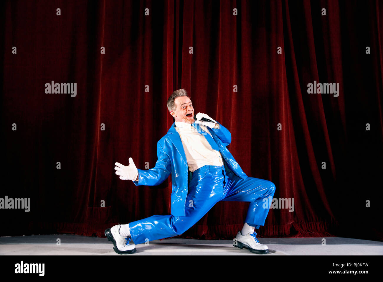 comedian performing on stage Stock Photo Alamy