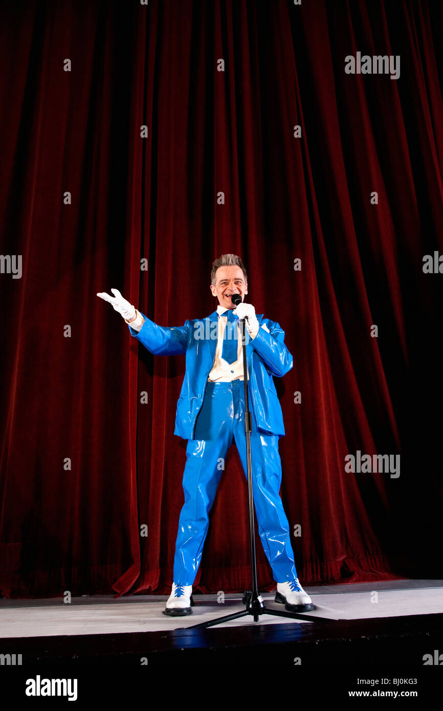 comedian performing on stage Stock Photo