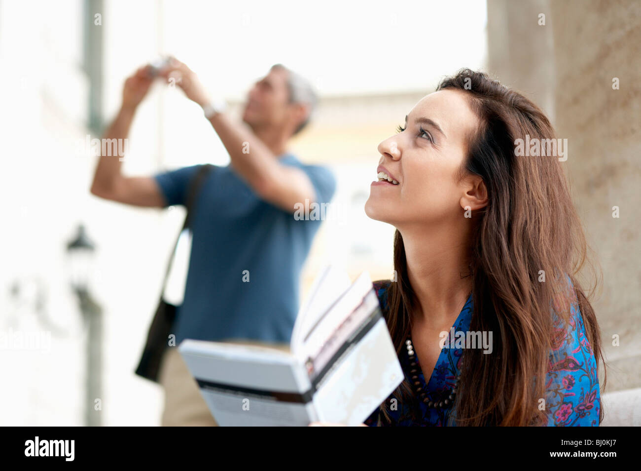 portrait of young woman with travel guide Stock Photo