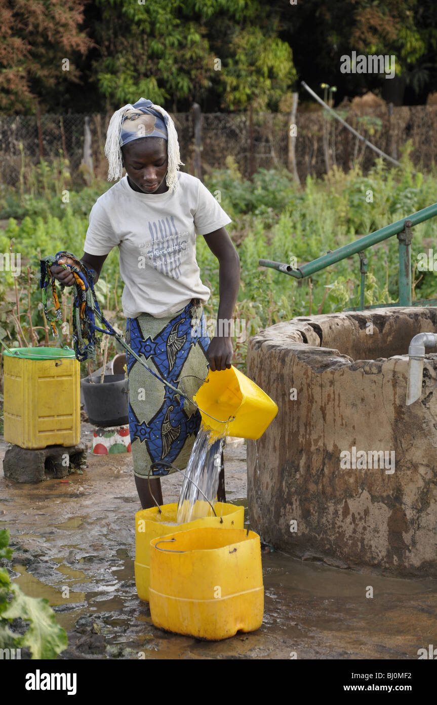 Woman drawing water from well hires stock photography and images Alamy