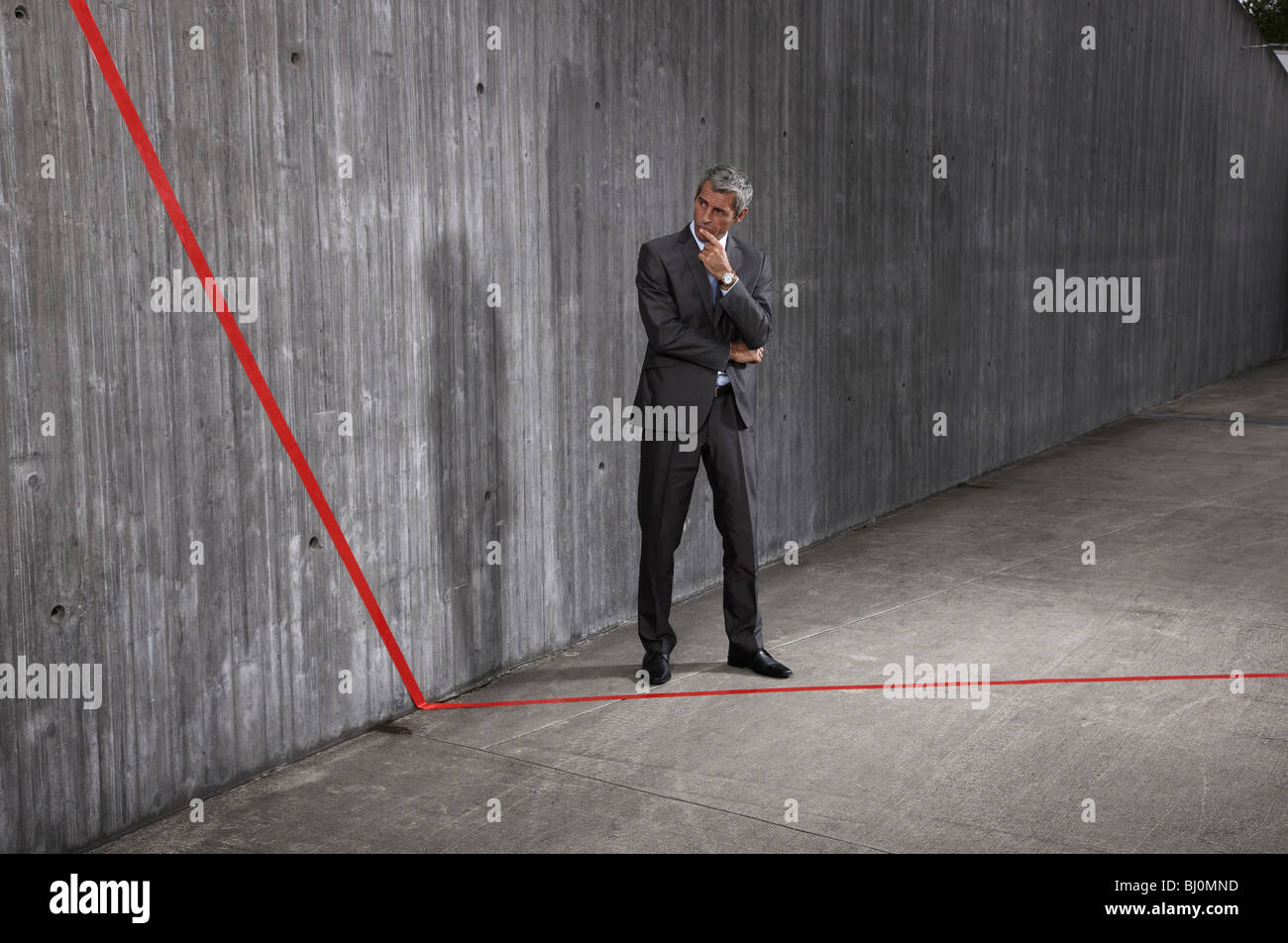 businessman looking at red line Stock Photo