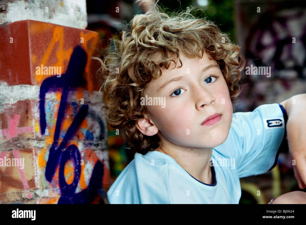 portrait of pensive young boy with curly hair Stock Photo - Alamy