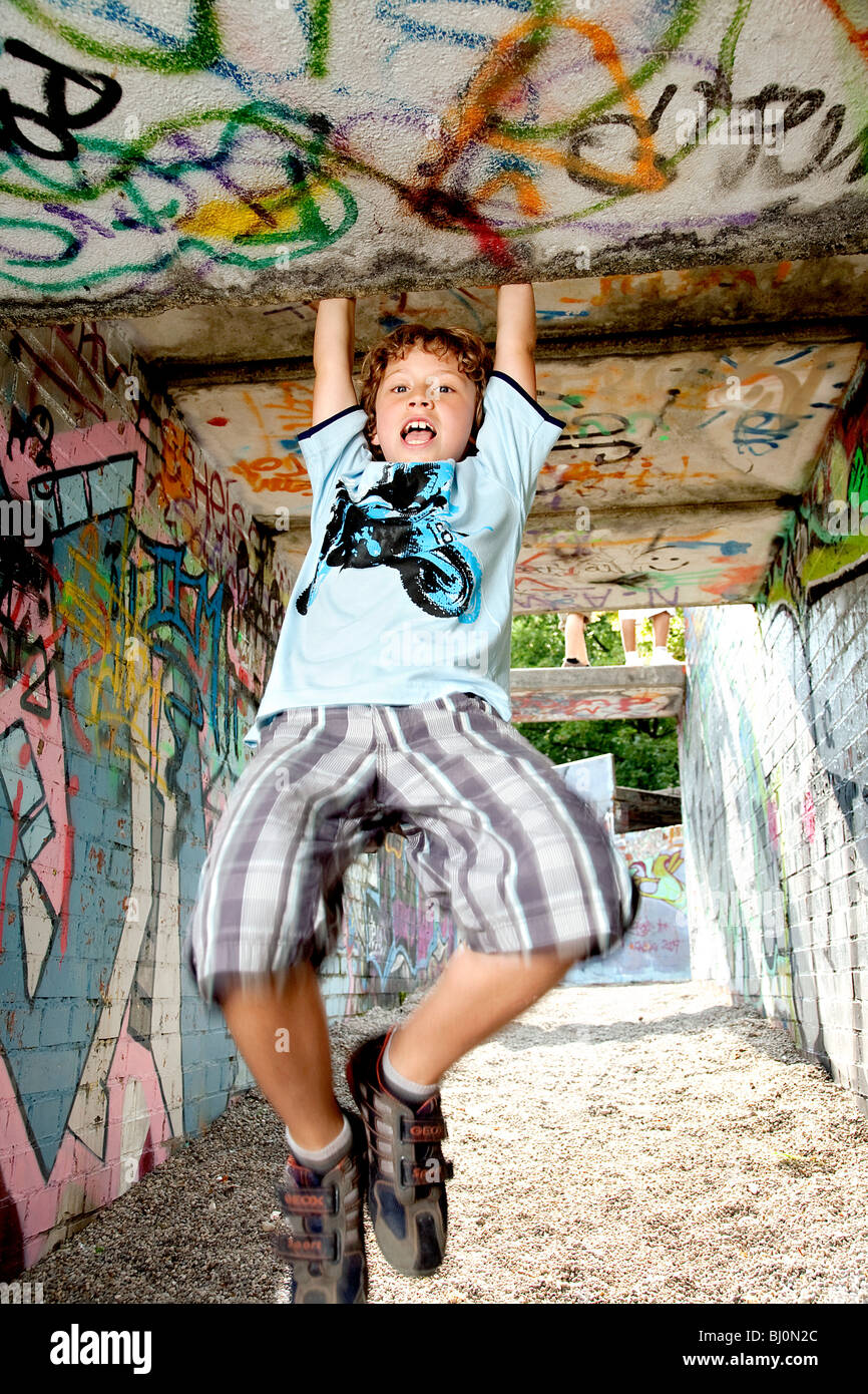 young boy playing on playground Stock Photo