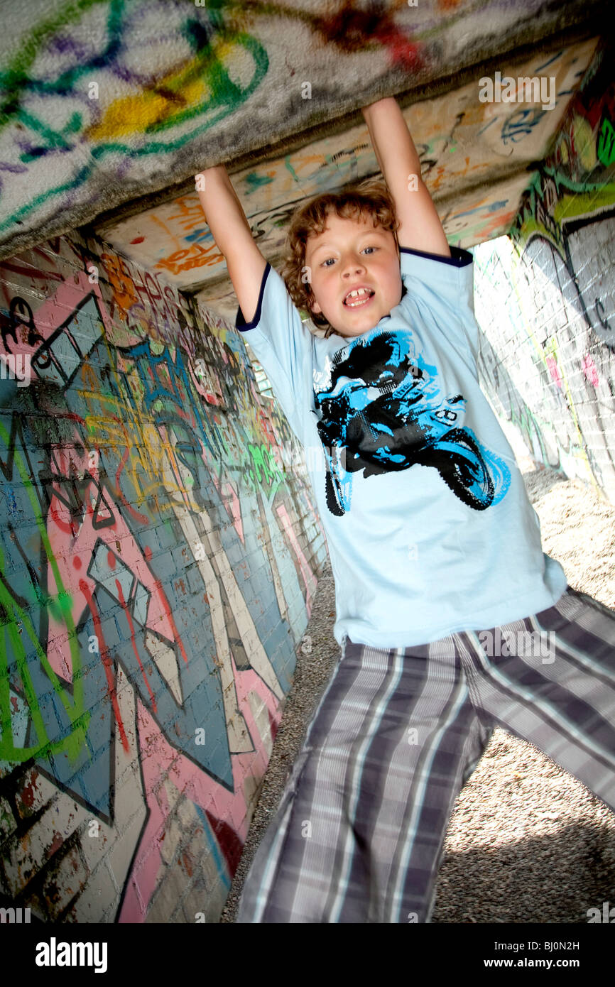 young boy playing on playground Stock Photo - Alamy