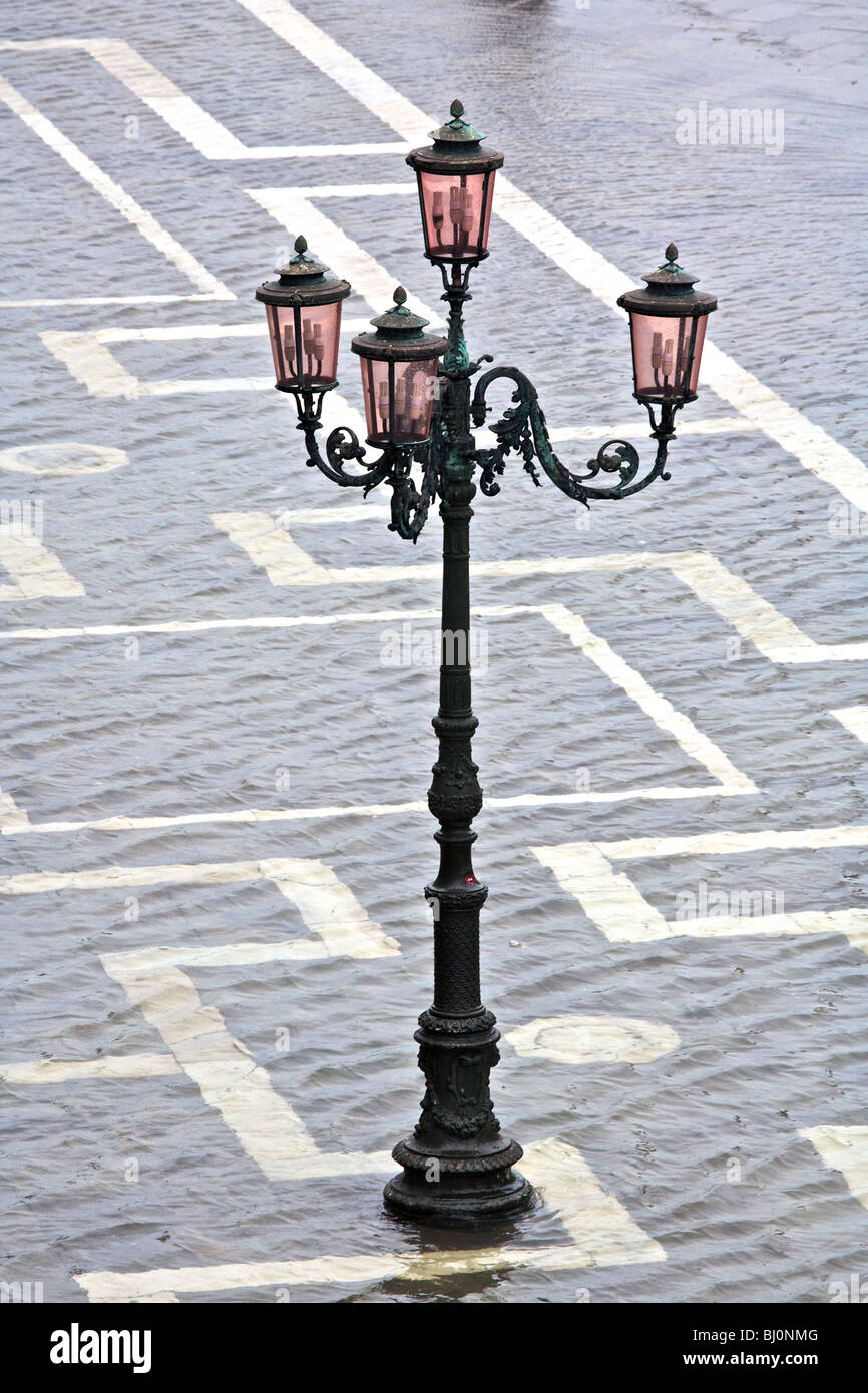 Ornate lampost in a flooded Piazzetta San Marco in Venice, Veneto, Italy Stock Photo