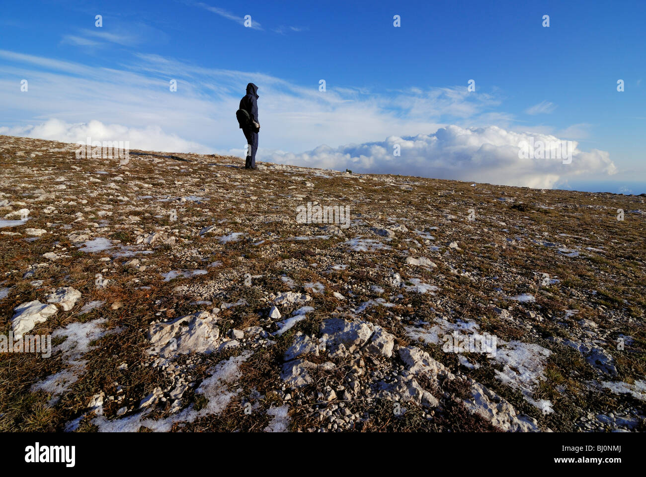 hiker looking down from ai-petri mountain on crimea Stock Photo