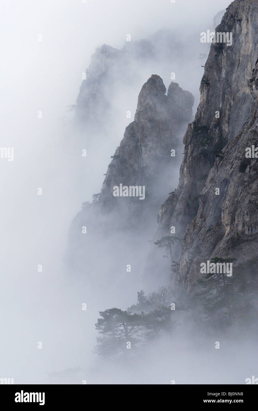 rocks of ai-petri mountain on crimea covered in fog Stock Photo