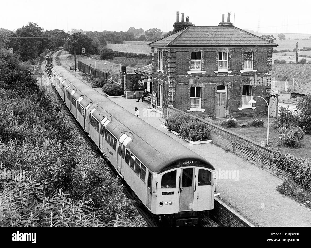 A London Underground train stopping at Blake Hall station on the Epping to Ongar section of the Central Line on 23.9.81. Stock Photo