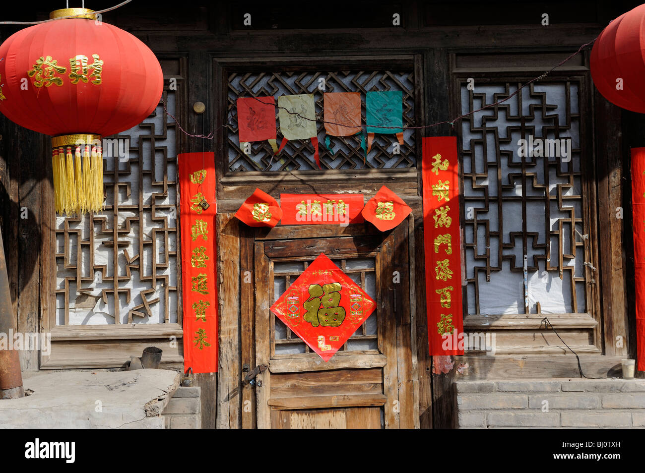 Spring Festival couplets on the door of an old house over 500 years in Yuxian, Hebei, China. 01-Mar-2010 Stock Photo