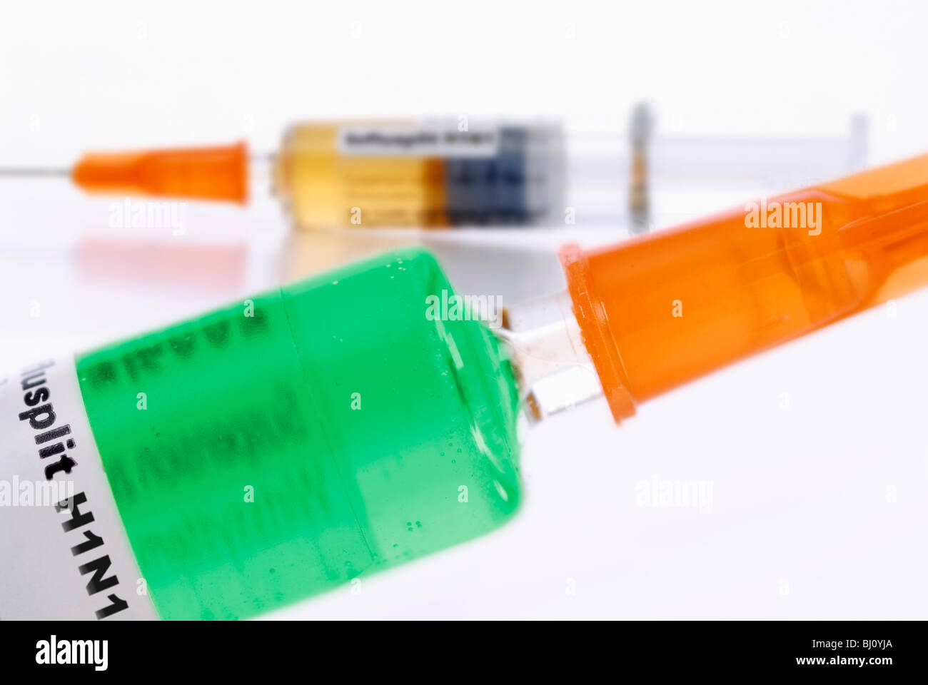 Different vaccines against swine flu in two syringes Stock Photo
