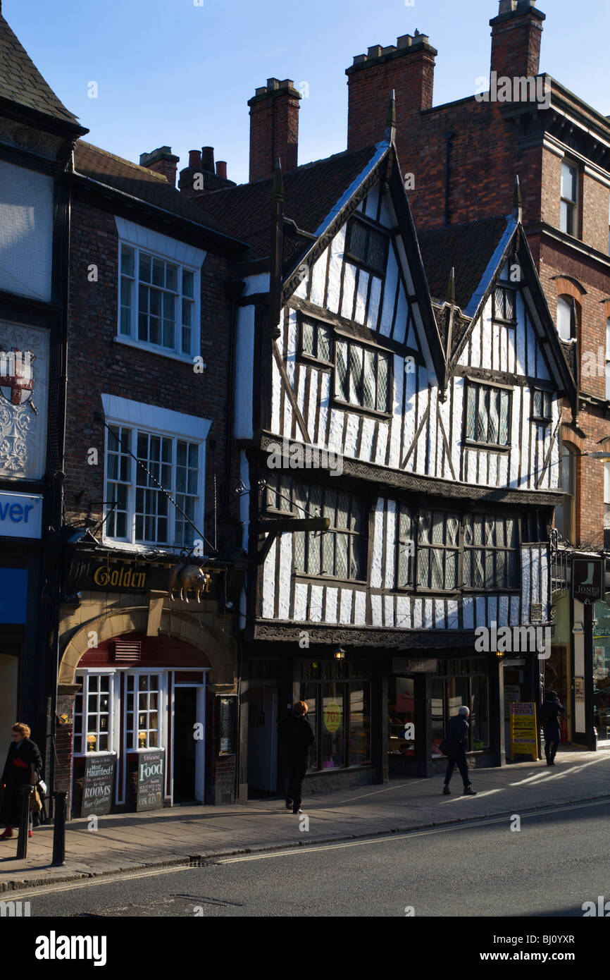 Golden Fleece Pub and Half Timbered Building on Pavement York Yorkshire England Stock Photo