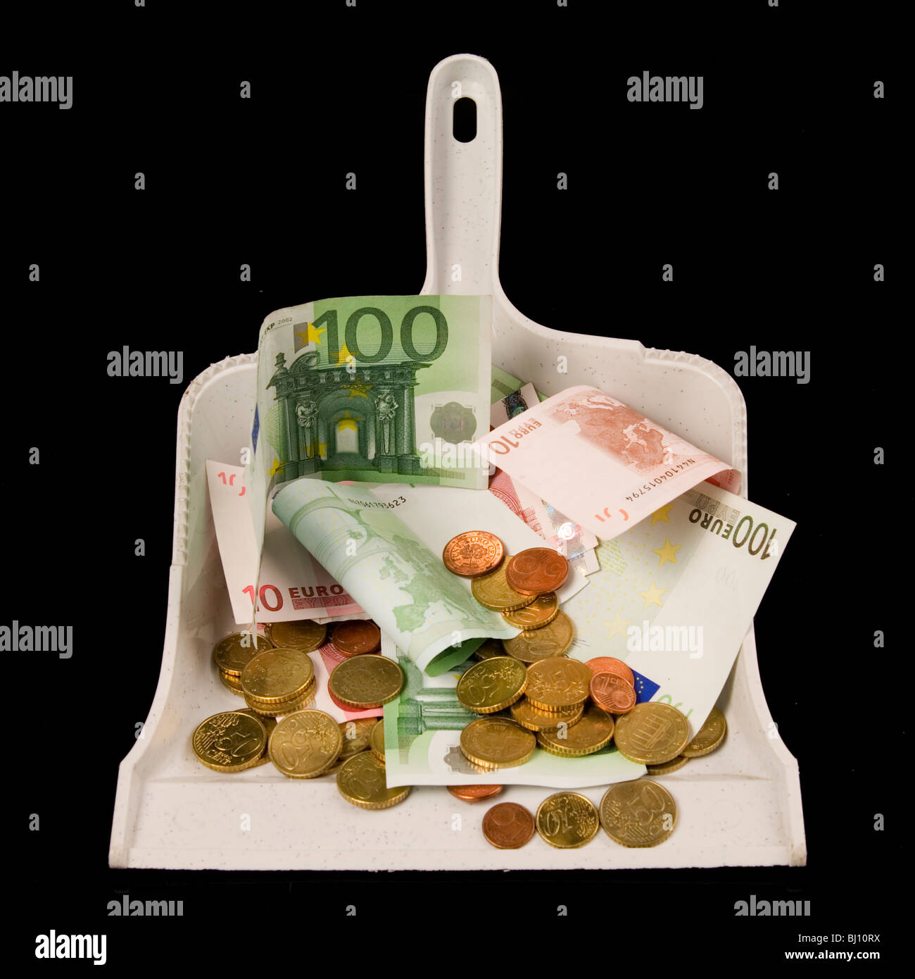 money in a shovel Stock Photo Alamy