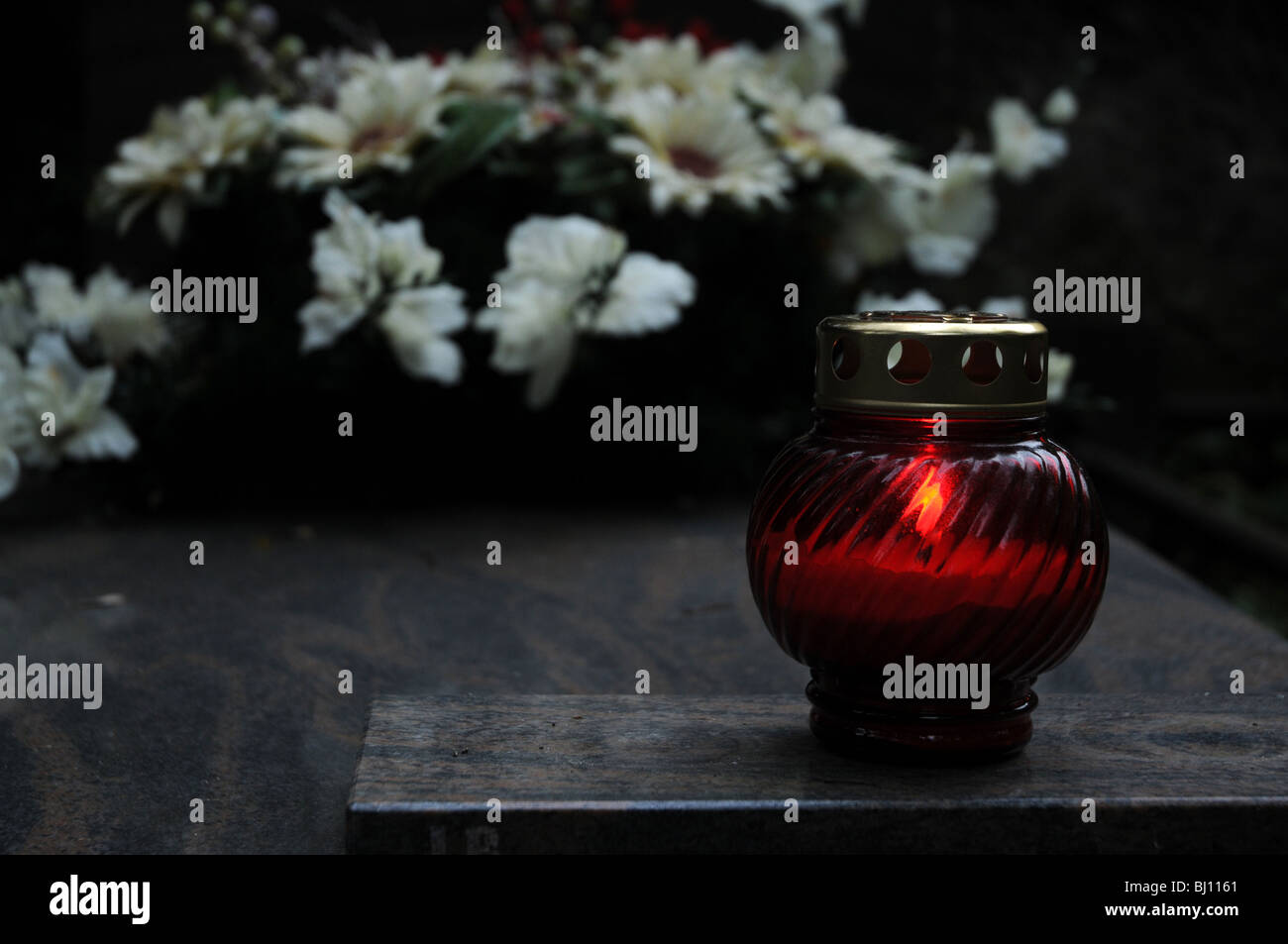Single candle on grave, old Powazki cemetery in Warsaw, Poland Stock