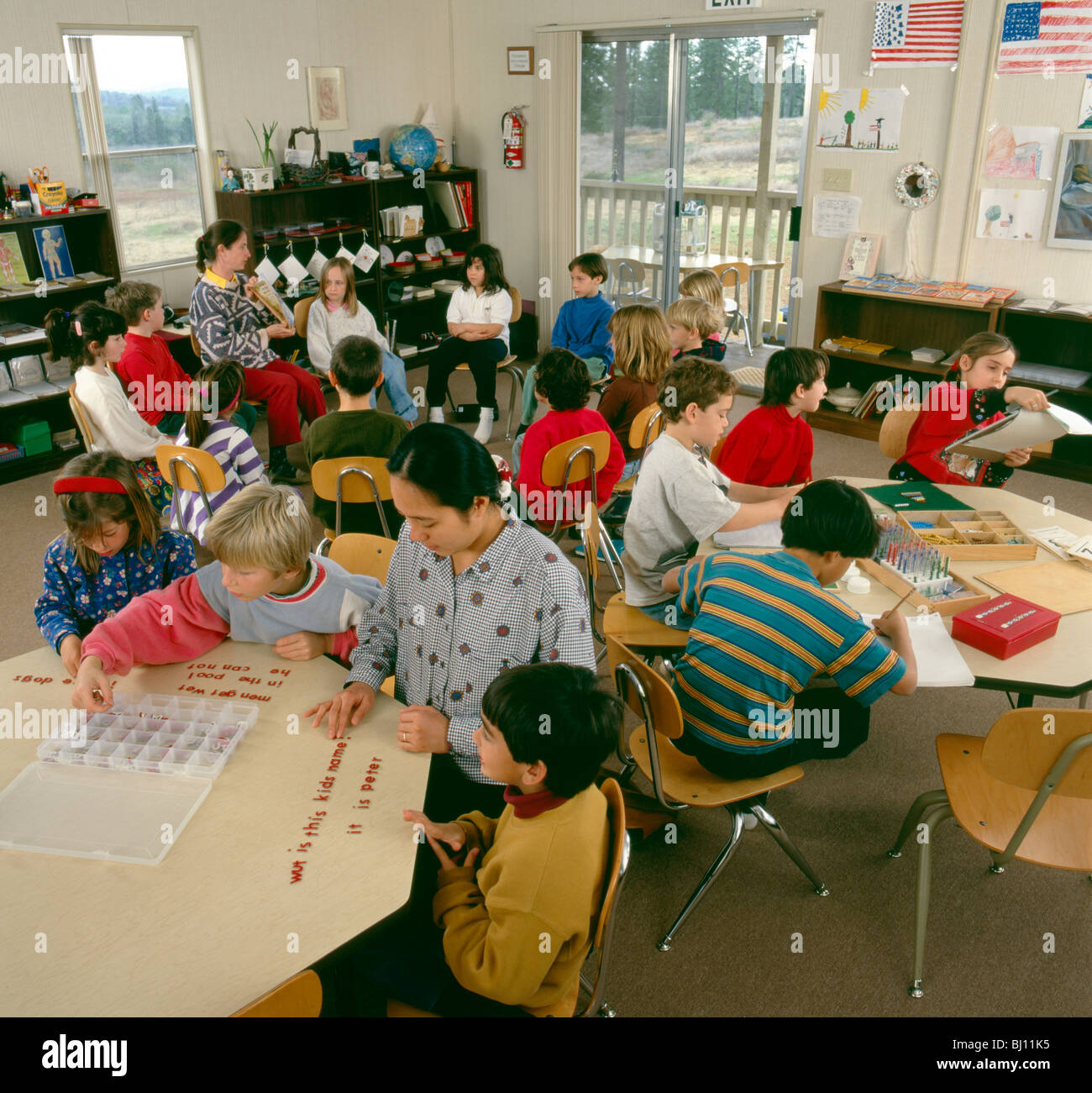 Teacher and students in an elementary school classroom Stock Photo