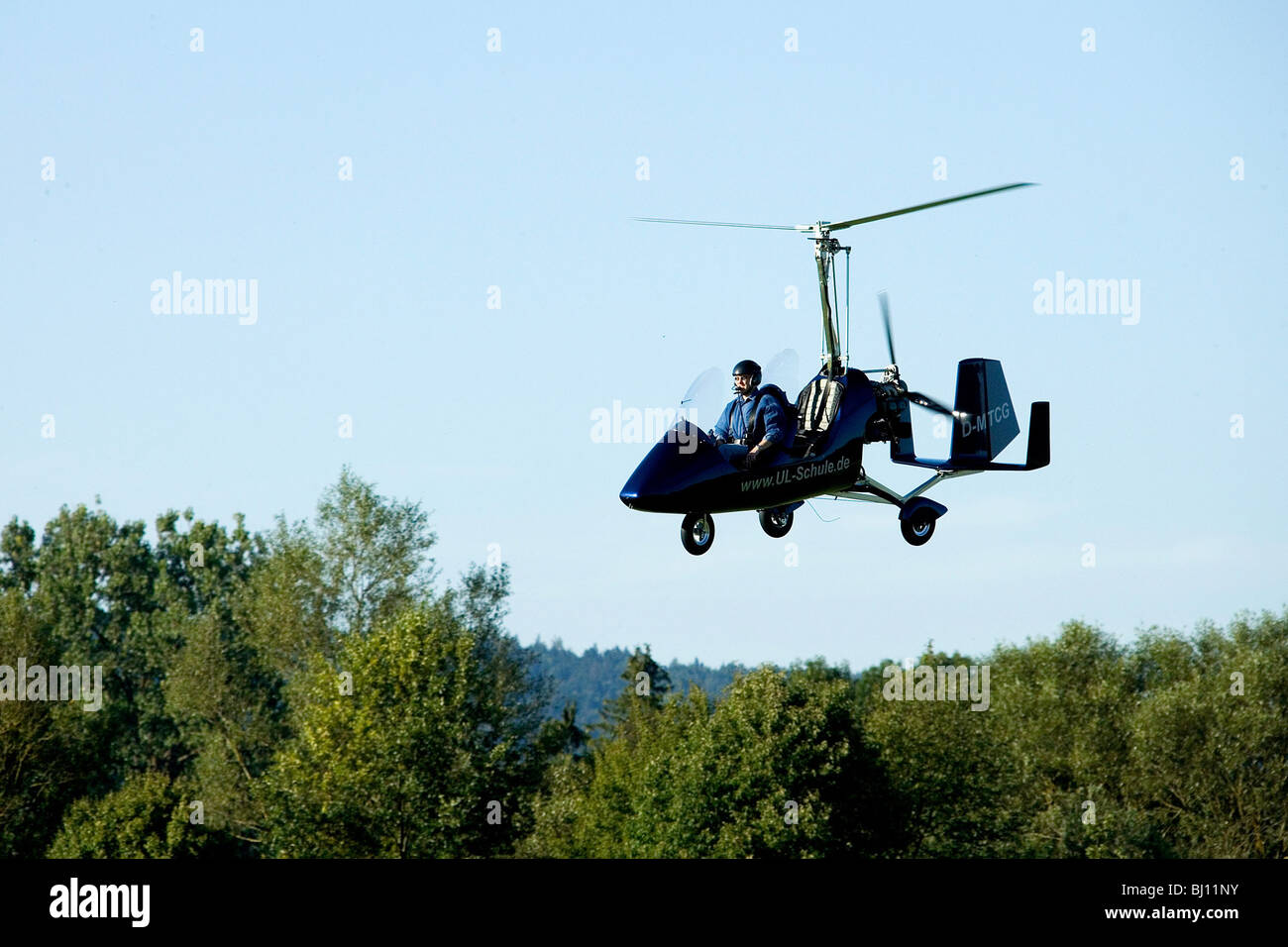 Flying gyroplane Stock Photo