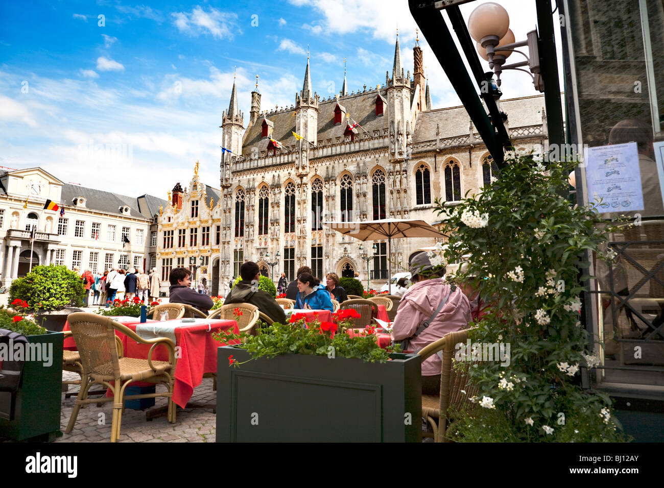 Restaurant in Burg square with the City Hall Bruges West Flanders Belgium Stock Photo