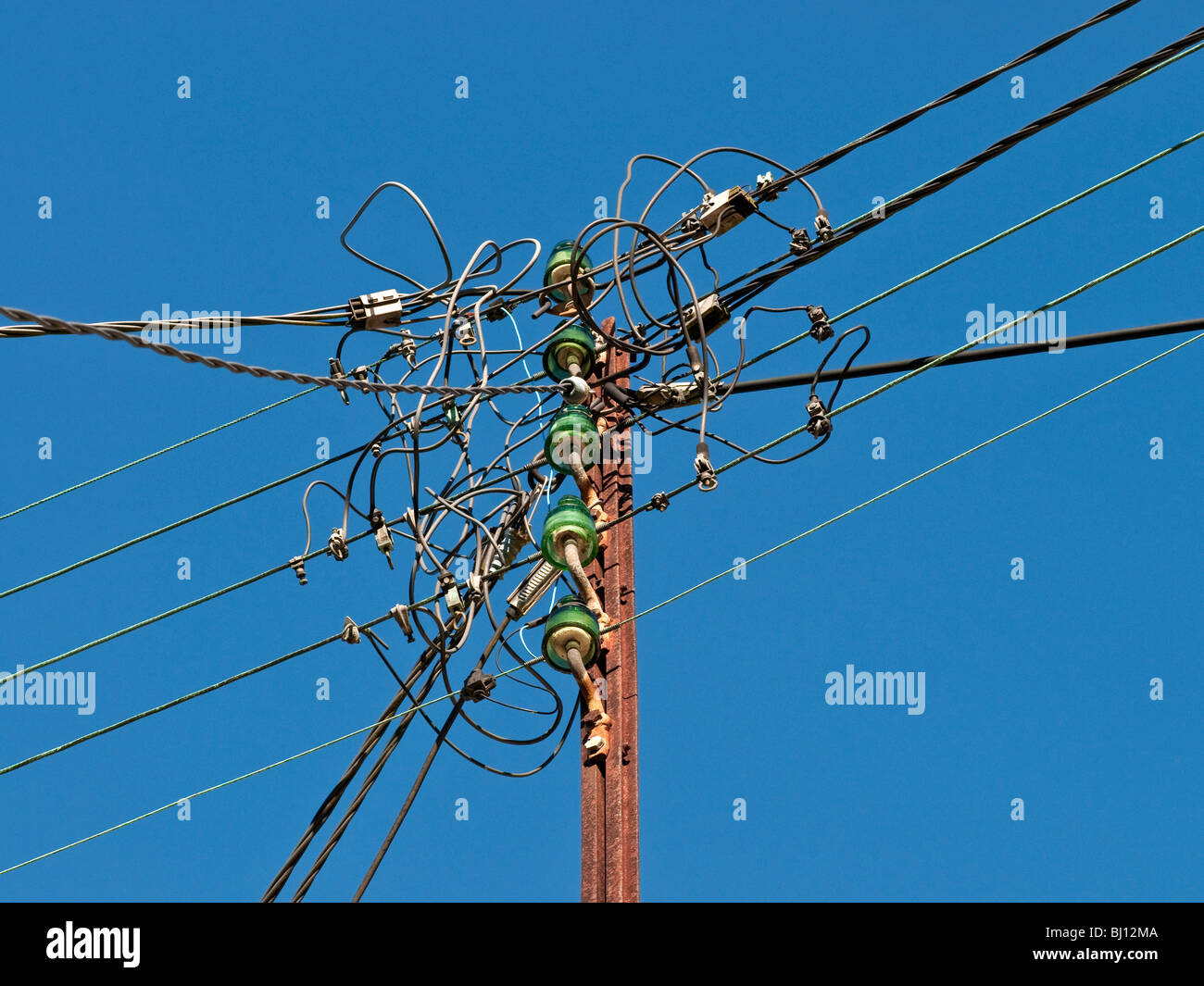 Old domestic mains electricity supply pole France Stock Photo Alamy
