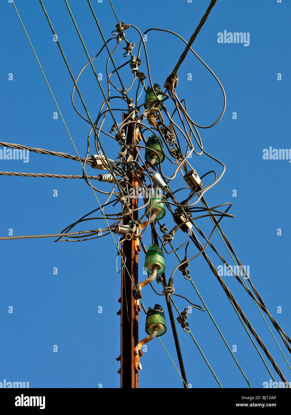 Old domestic mains electricity supply pole France Stock Photo Alamy