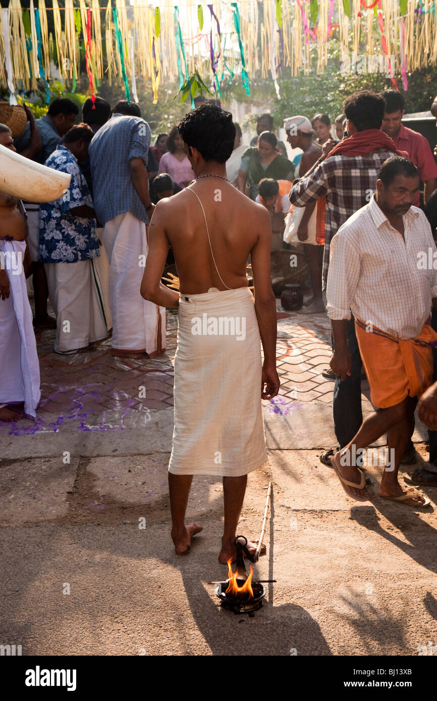 India, Kerala, Kochi, Ernakulam Uthsavom festival, Diwans Road, priest carrying sacred fire for puja Stock Photo