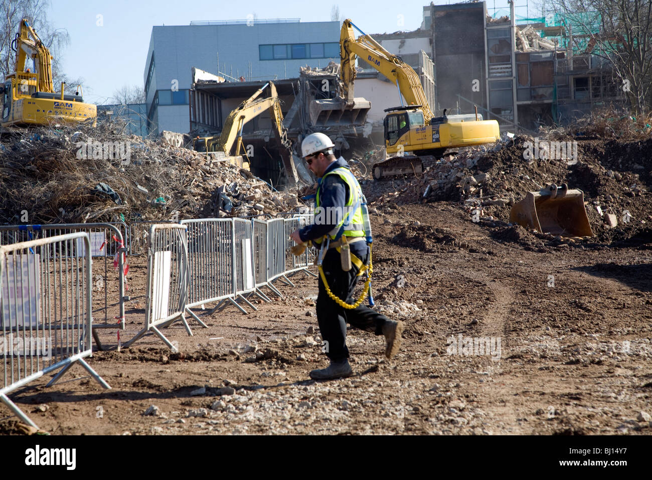 Demolition site worker wearing safety clothing hard hat Suffolk College