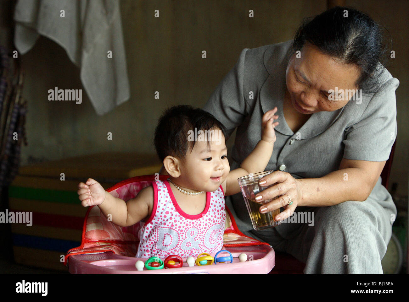 Grandmother with her grandson, Hue, Vietnam Stock Photo