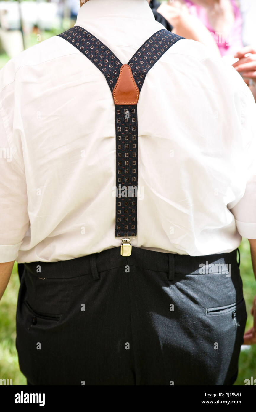 Rear view of man wearing suspenders Stock Photo - Alamy