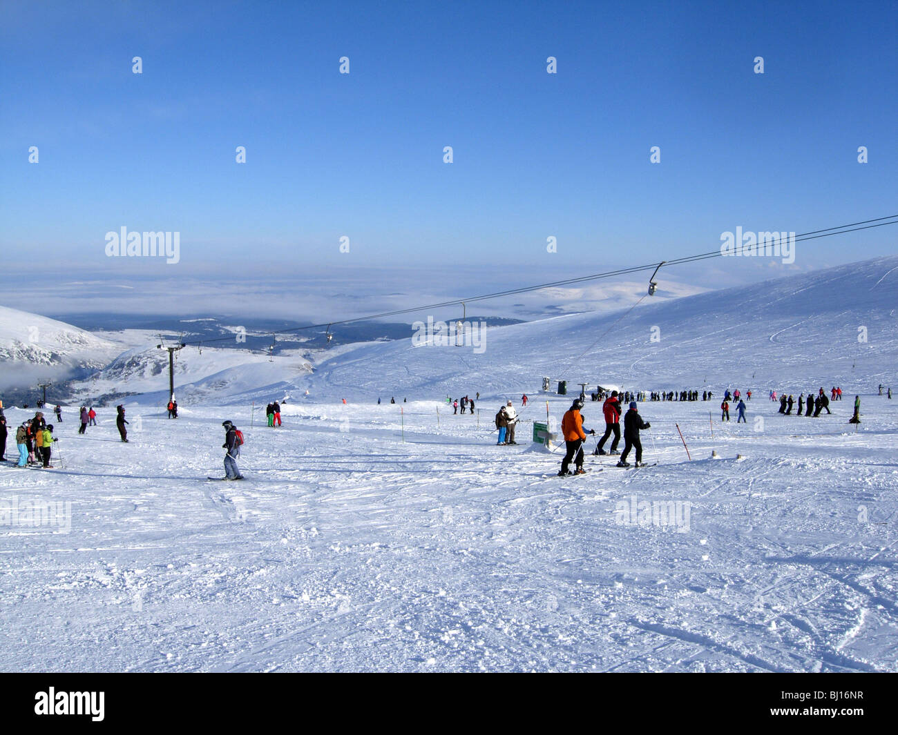 Skiers on Cairngorm mountain in Scotland in perfect snow conditions Stock Photo