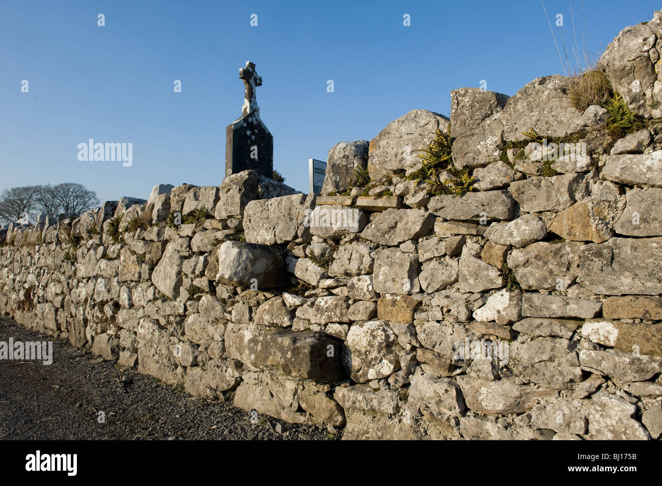 Stone steps in the stone wall of a graveyard in Keelogues, Co. Mayo, Ireland. Stock Photo