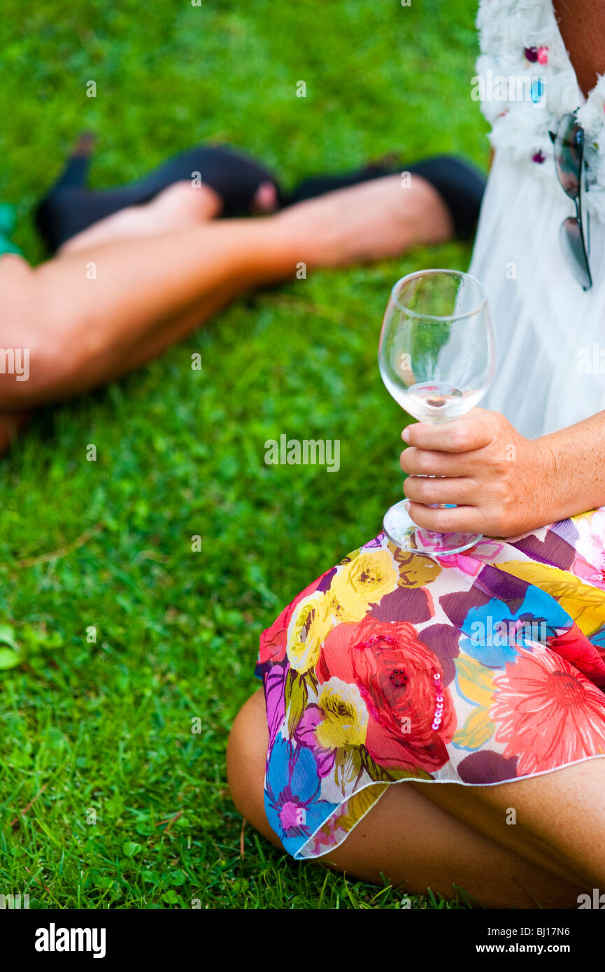 Woman holding glass of wine hi-res stock photography and images - Alamy