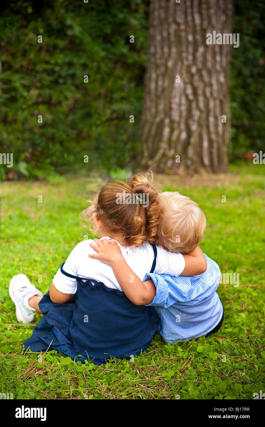 Two children hugging each other hi-res stock photography and images - Alamy