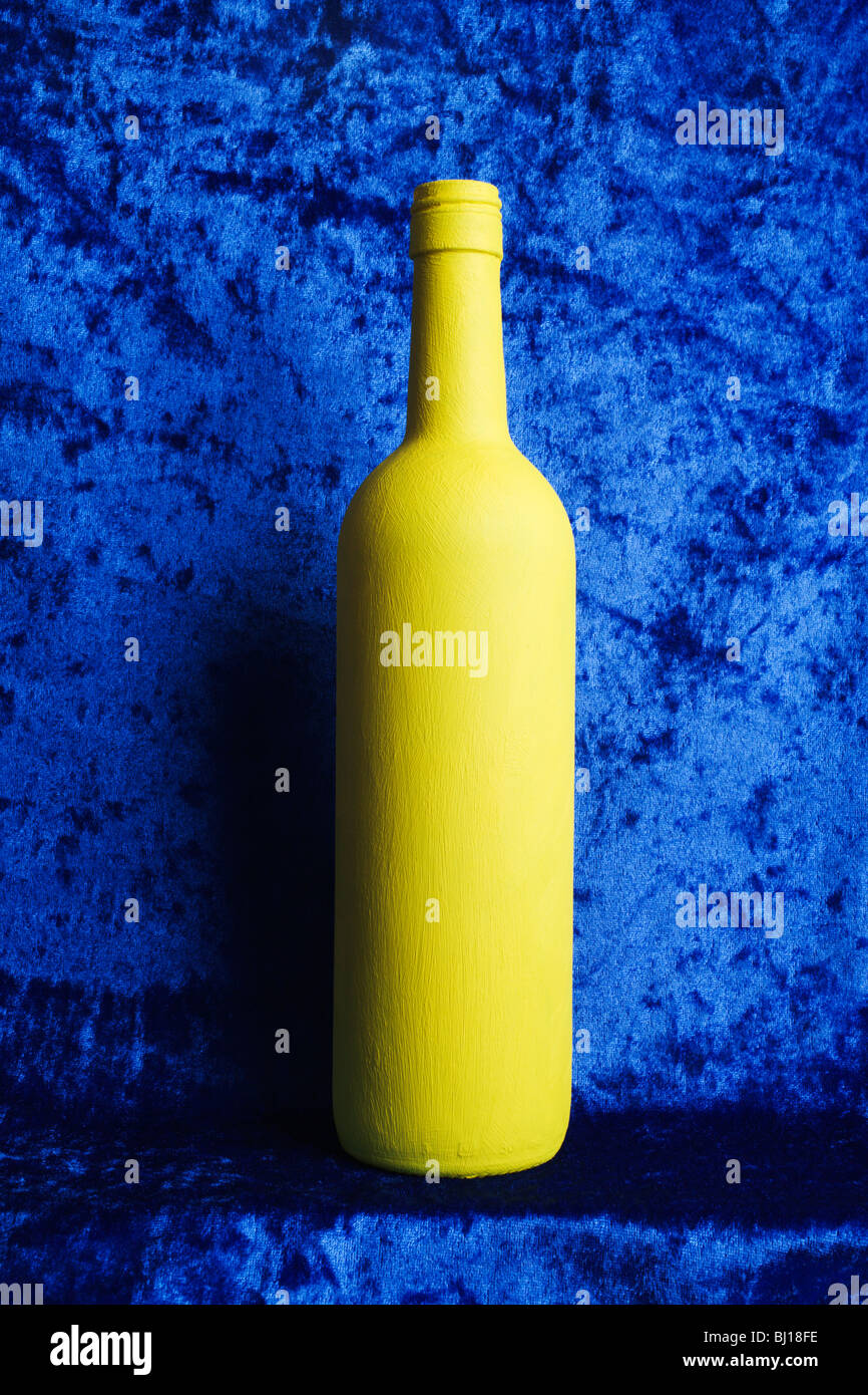 Download A Yellow Painted Bottle On A Blue Background Stock Photo Alamy Yellowimages Mockups