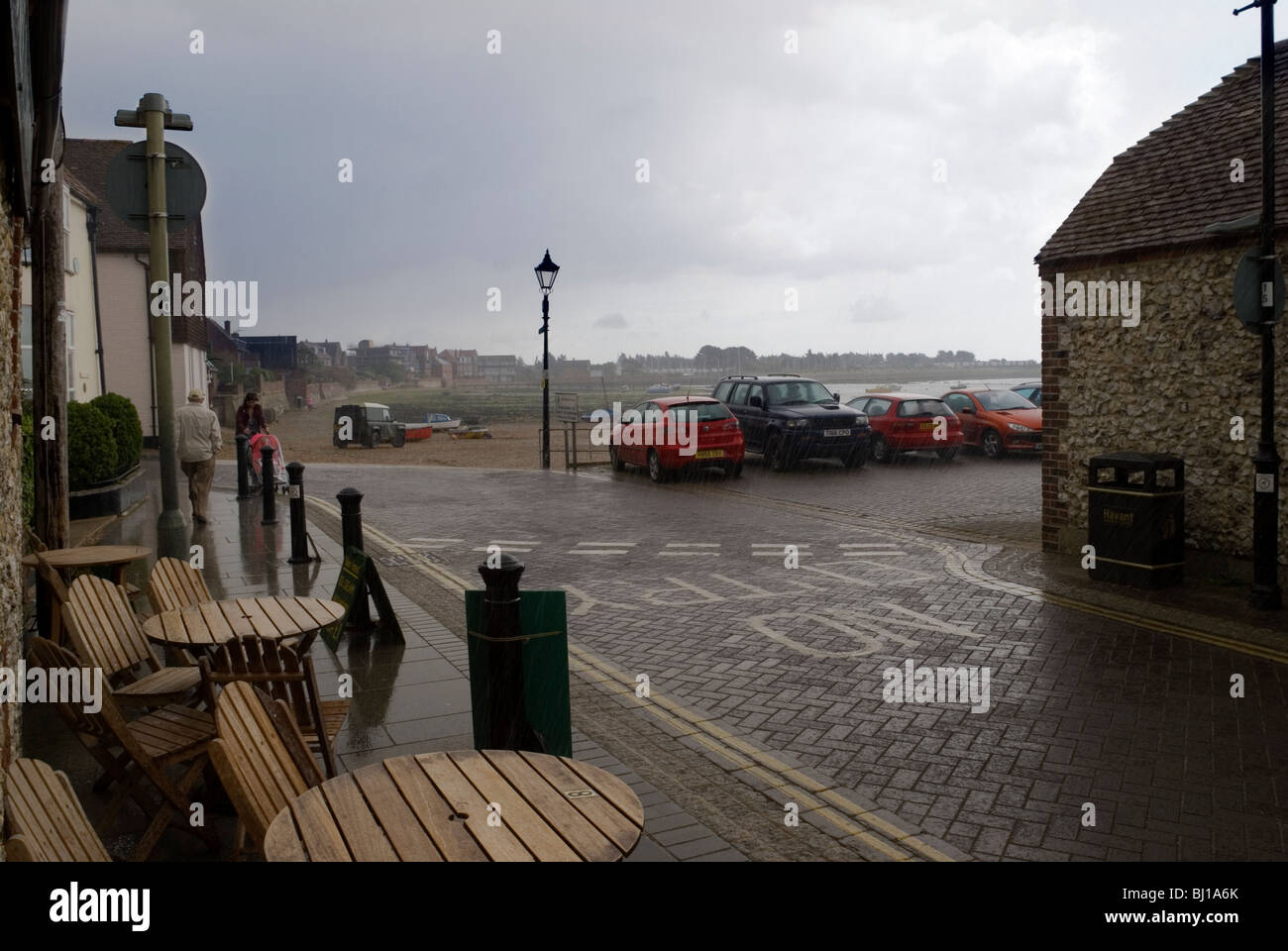 Stormy sky and rain at Emsworth harbour quay cafe in Sussex Stock Photo