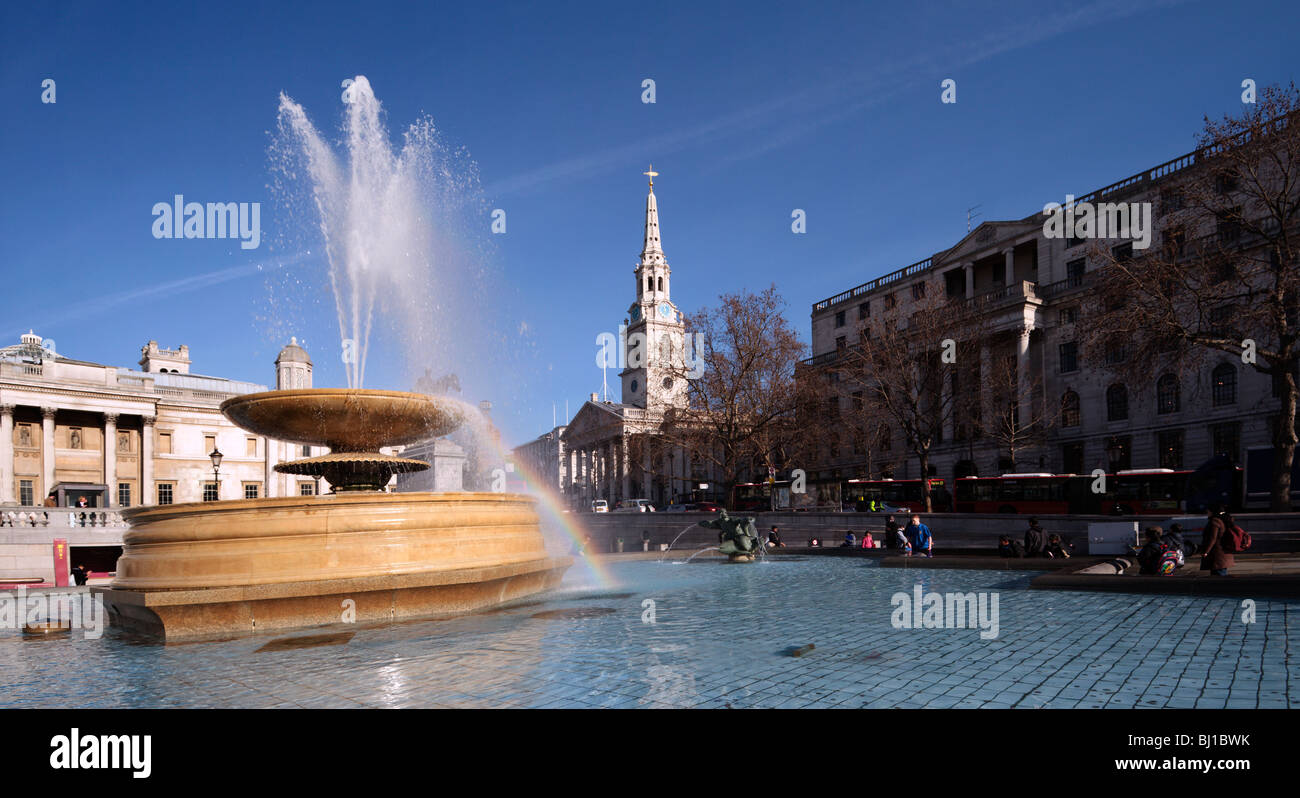 Fountain and St Martin in the Fields church Trafalgar Square London England UK Stock Photo