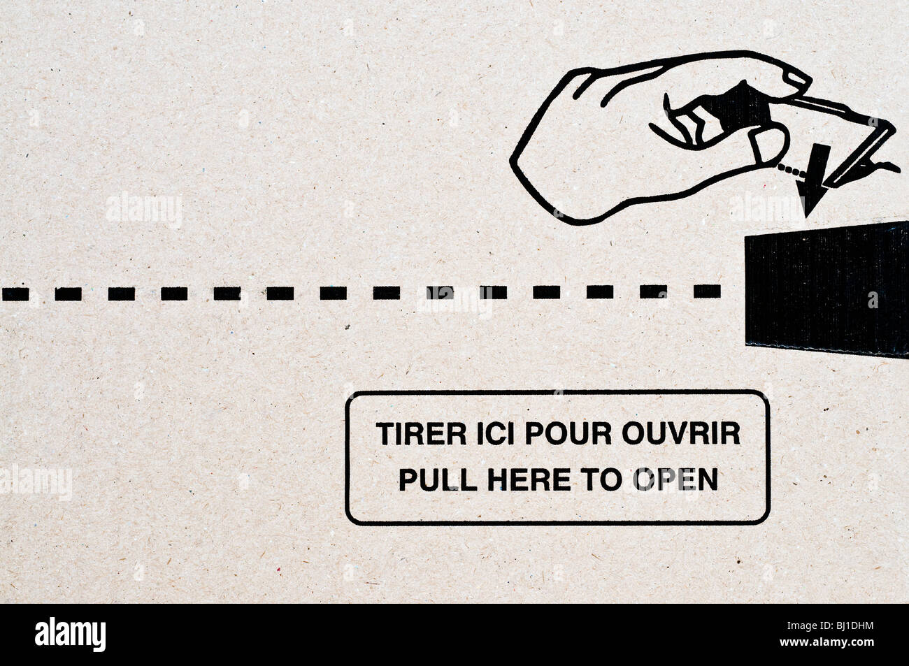 French / English language cardboard box opening information. Stock Photo